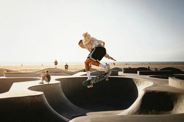A skateboarder at Venice Beach with the Kodak FunSaver treatment, adding stronger tones, grain, and darker edges.