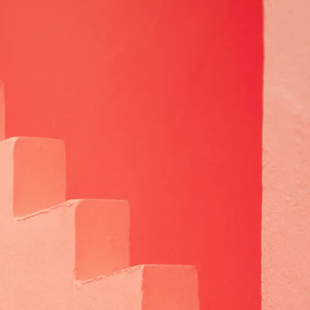 The matching stair crop with Grain at zero, showing smoother wall and step faces while the photographed wall texture and soft edges remain.